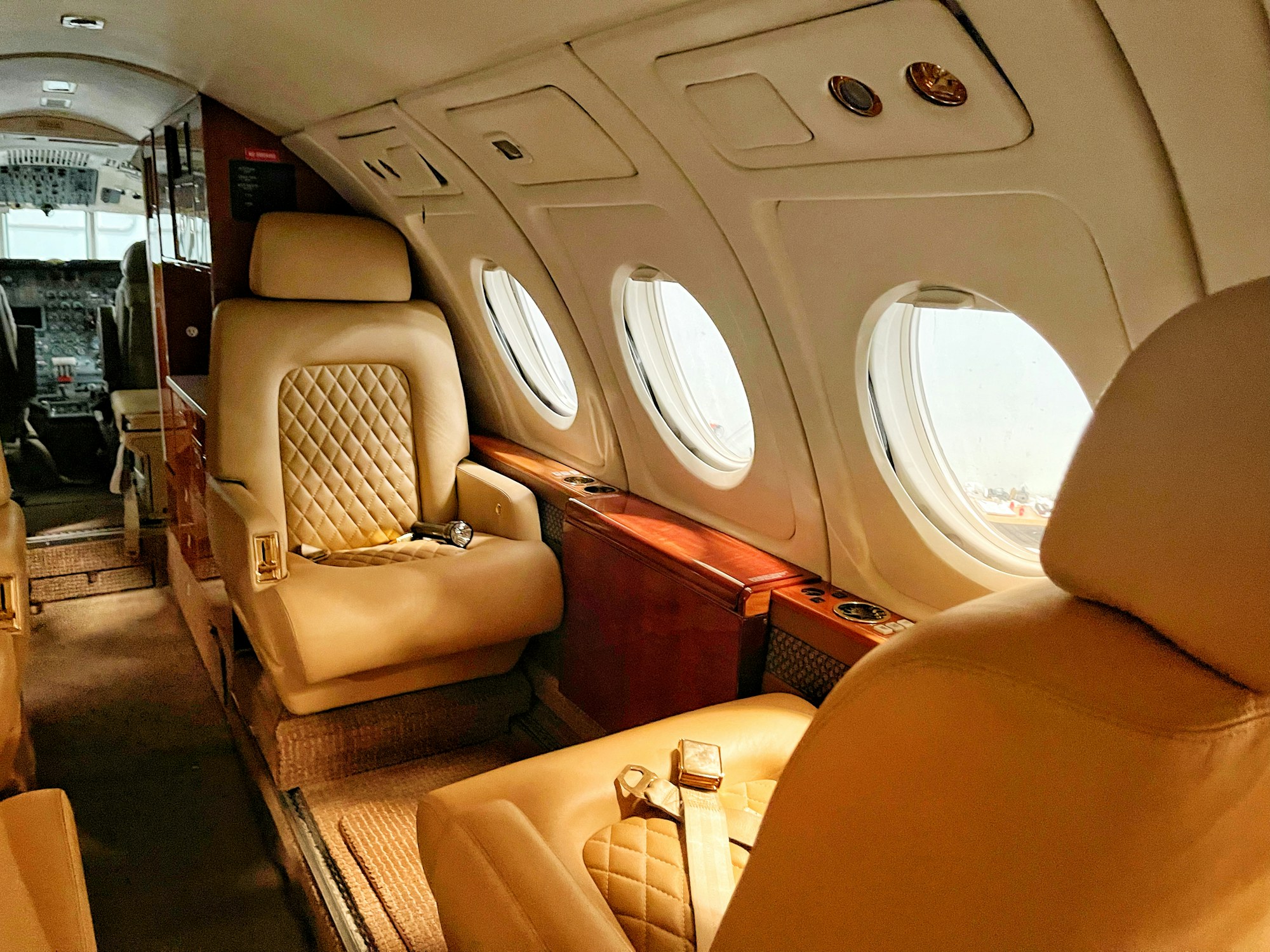 Quilted leather seats in a private jet cabin